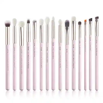 Set of 15 makeup brushes with pink handles on a white background