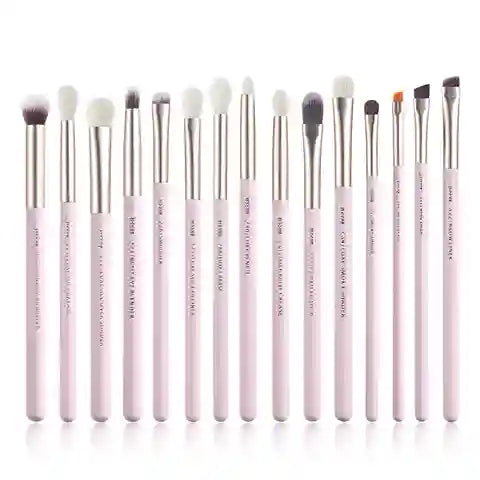 Set of 15 makeup brushes with pink handles on a white background