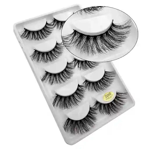 Set of false eyelashes in a clear packaging case on a white background