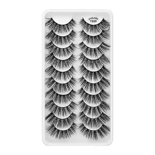 Set of false eyelashes in a clear plastic case on a white background