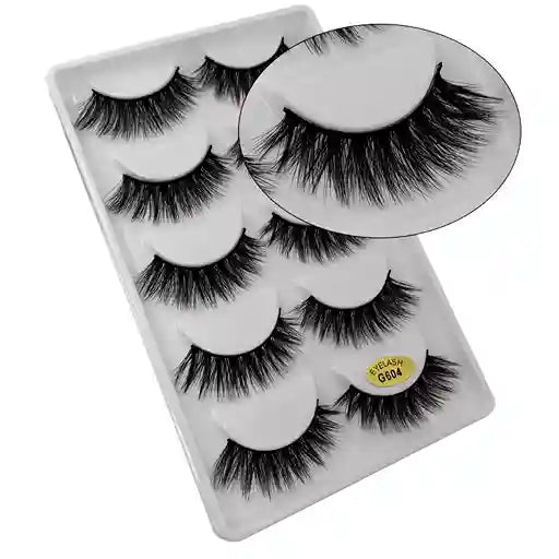 Set of false eyelashes in a clear plastic case with a white background