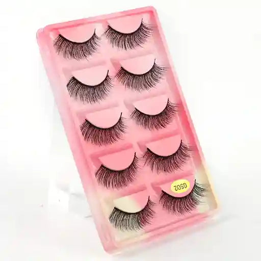 Set of false eyelashes in a pink case on a white background