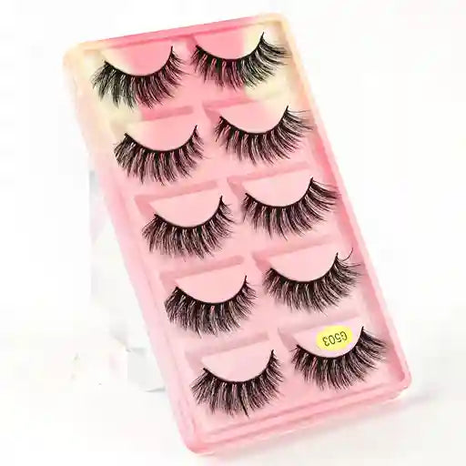 Set of false eyelashes in a pink case with a white background