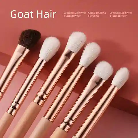 Set of makeup brushes with goat hair on a pink background