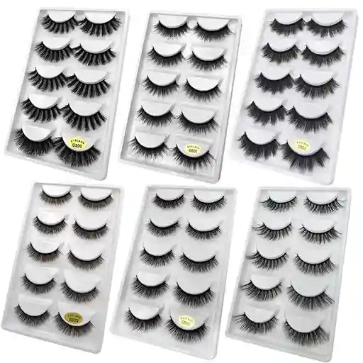 Set of six pairs of false eyelashes in clear packaging on a white background