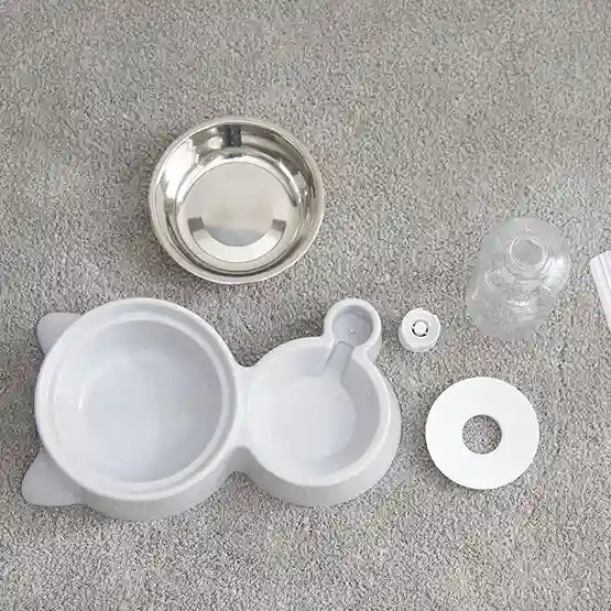 Set of white plastic components on a gray surface