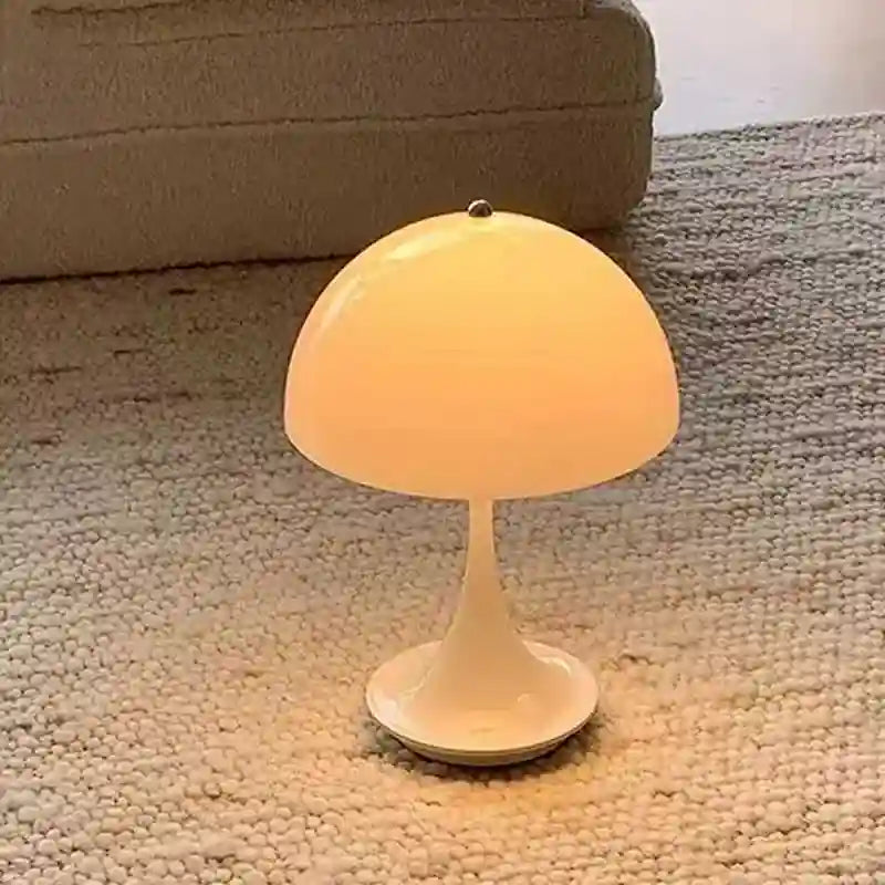 Small mushroom-shaped lamp on a carpeted floor