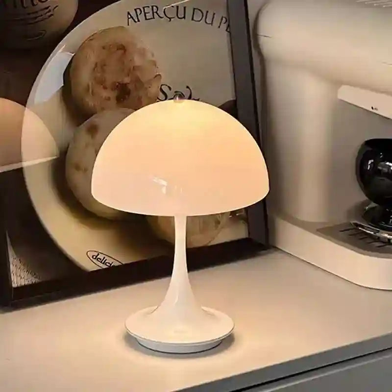 Small mushroom-shaped lamp on a surface with a blurred background