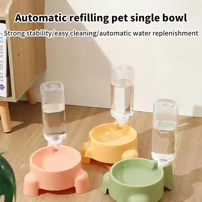 Three colorful pet water bowls with automatic refilling system on a wooden floor.