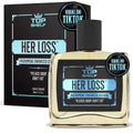 Top Shelf 'Her Loss' cologne bottle and packaging on a white background