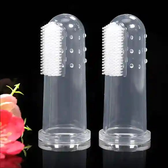 Two clear plastic toothbrush holders with white bristle brushes on a black background.
