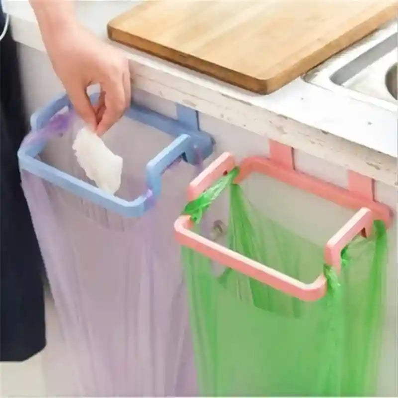 Two colorful plastic holders for hanging trash bags on a kitchen cabinet.