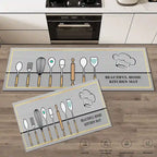 Two kitchen mats with utensil designs on a wooden floor.