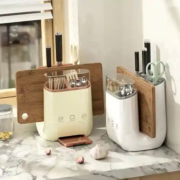Two kitchen organizers with wooden cutting boards on a marble countertop.