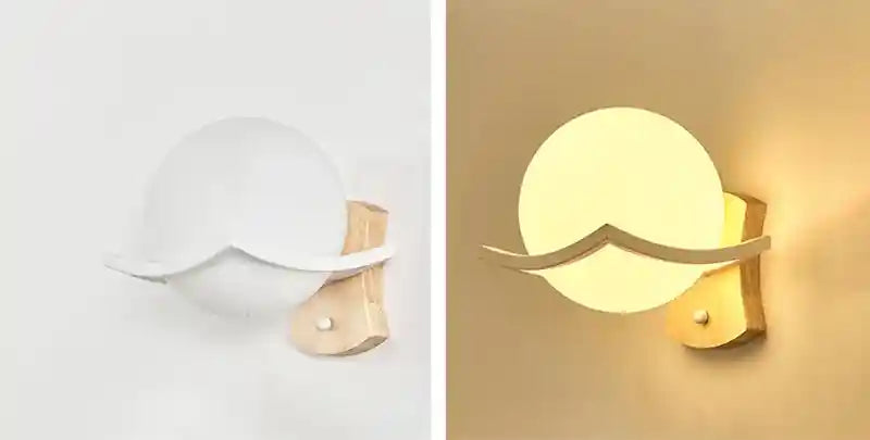 Two wall lights, one white and one gold, on a plain background.