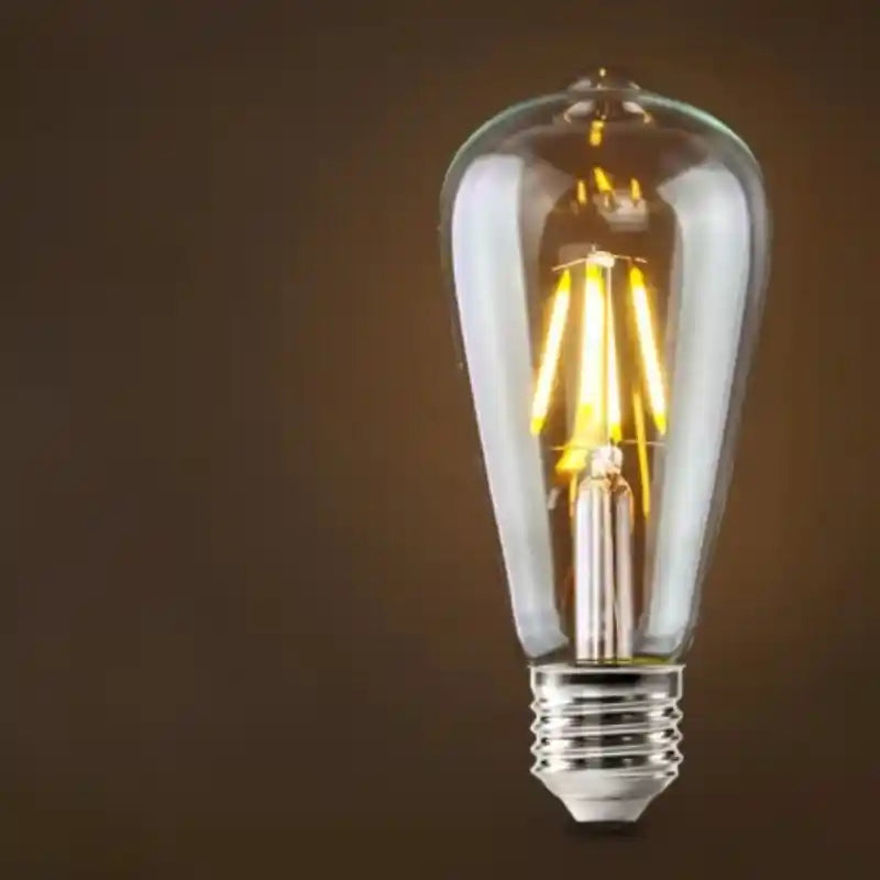 Vintage-style LED light bulb on a dark background