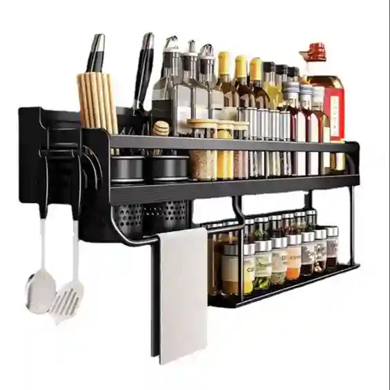 Wall-mounted kitchen organizer with various utensils and bottles on a white background
