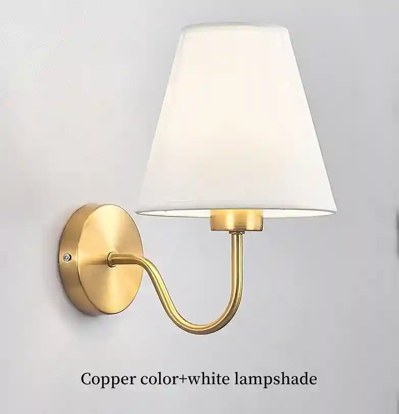 Wall-mounted lamp with white shade and copper fixture on a light gray background