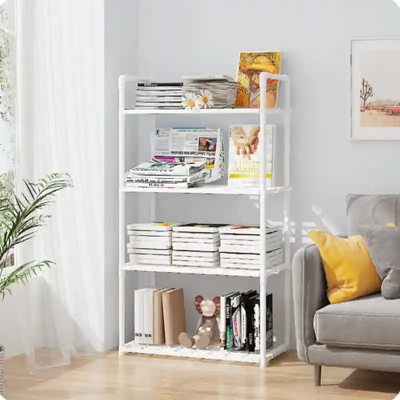 White bookshelf with books and magazines in a living room setting