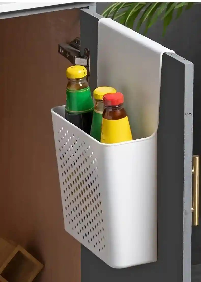 White cabinet organizer with bottles inside attached to a kitchen cabinet.