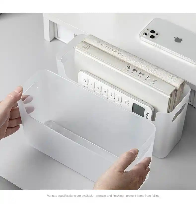 White electronic device with digital display on a white surface, with hands holding a clear plastic sheet.