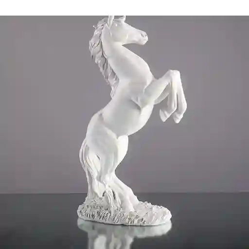 White horse figurine on a gray background