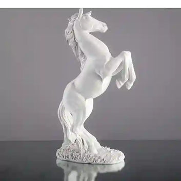 White horse figurine on a gray background