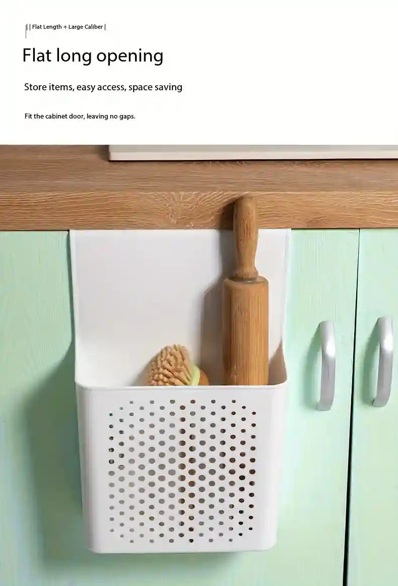 White storage basket with perforated design attached to a cabinet, containing kitchen items.