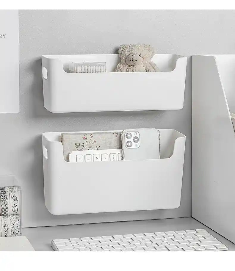 White wall-mounted storage bins with items in a minimalistic room setting.