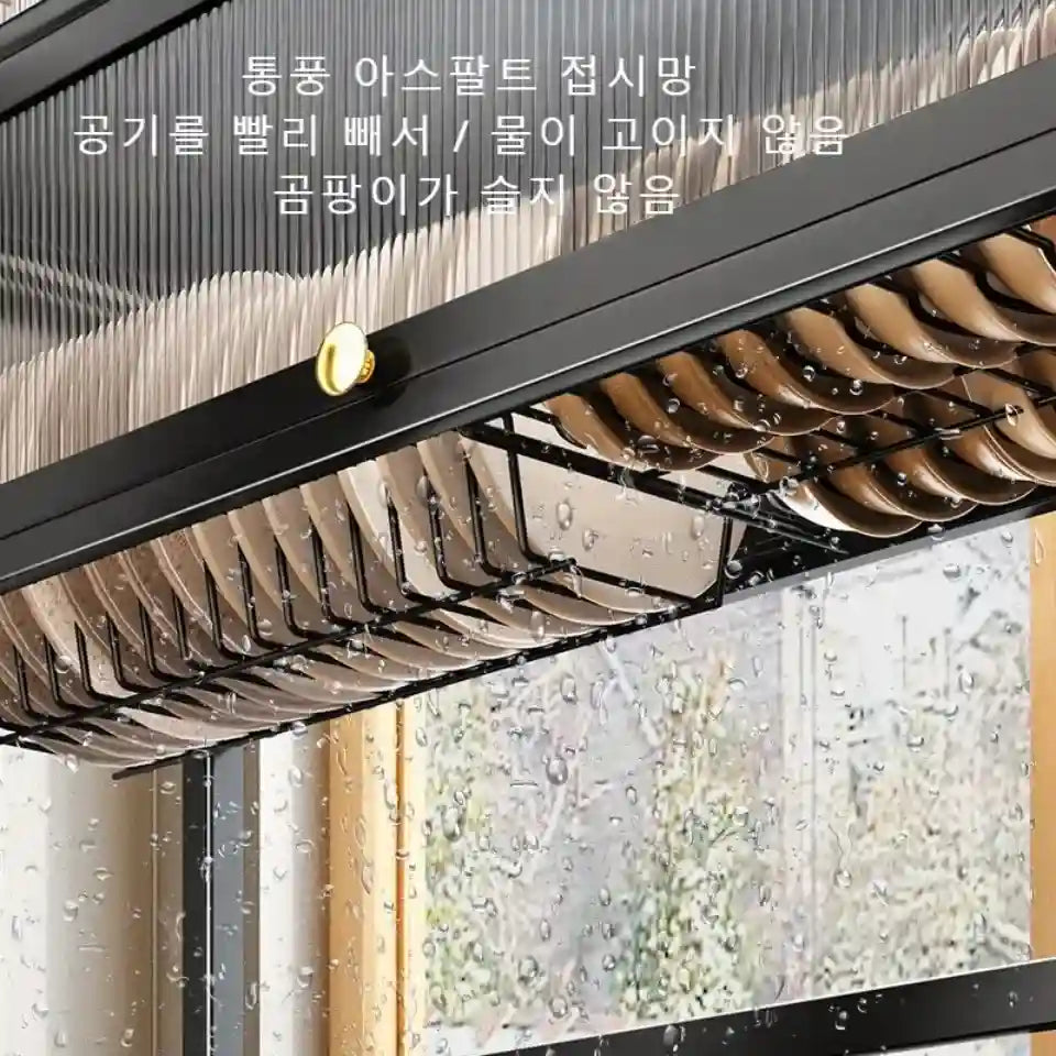 Window with raindrops and a black frame, featuring Korean text.