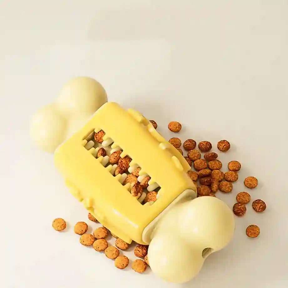 Yellow and white pet chew toy with small bones on a light background