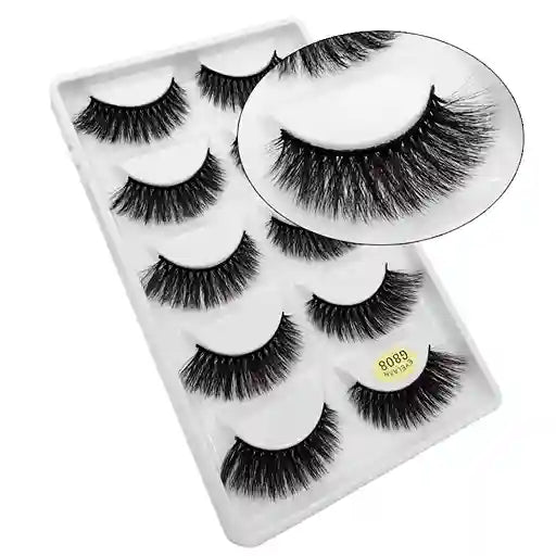 Set of false eyelashes in a clear plastic case on a white background