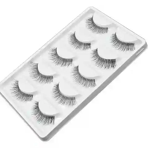 Set of false eyelashes in a clear plastic case on a white background