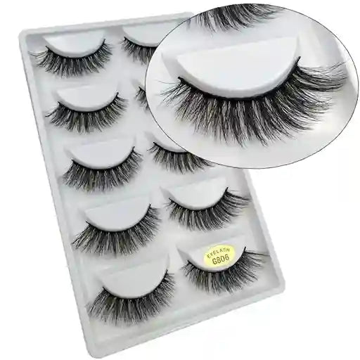 Set of false eyelashes in a clear plastic case with a white background