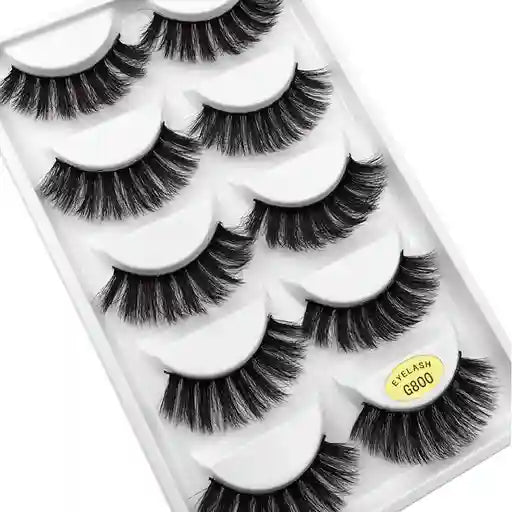 Set of false eyelashes in a packaging tray with a visible brand label.